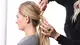 photo of stylist demonstrating how to style a low ponytail