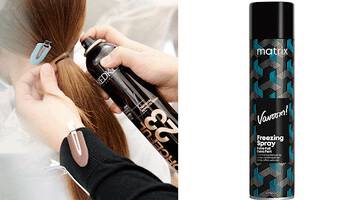 photo of stylist using hairspray on client in salon