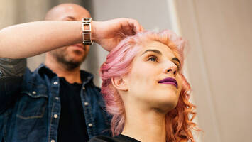 photo of stylist and woman with dusty rose hair color