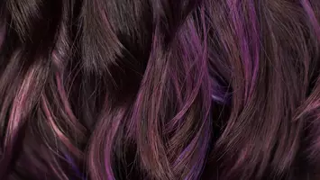 close up photo of purple highlights in hair