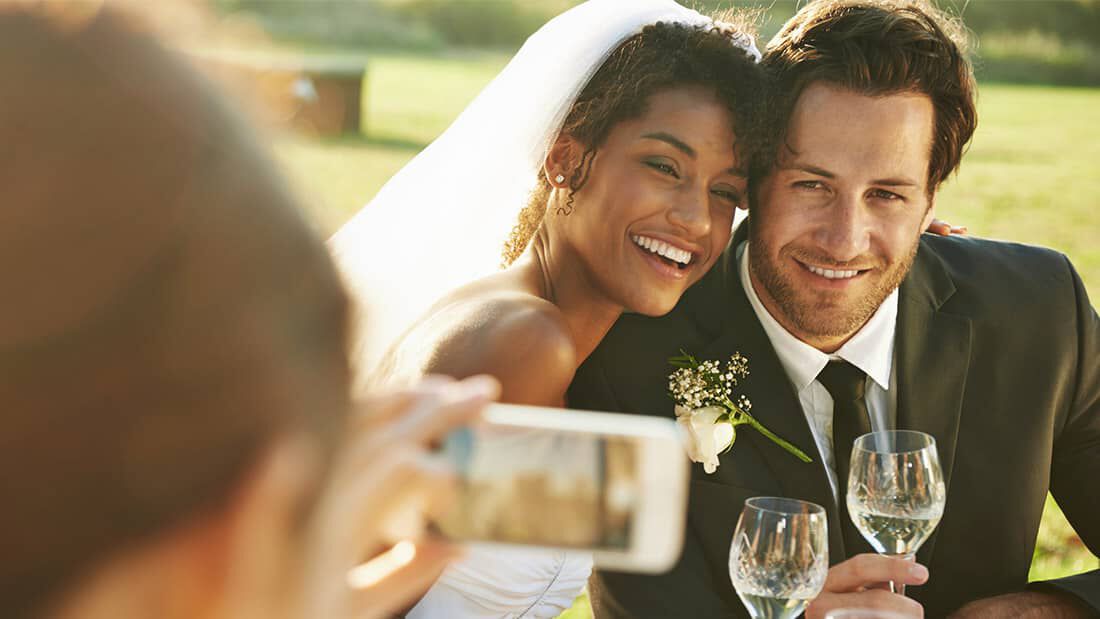 interracial couple cuddles for a photo