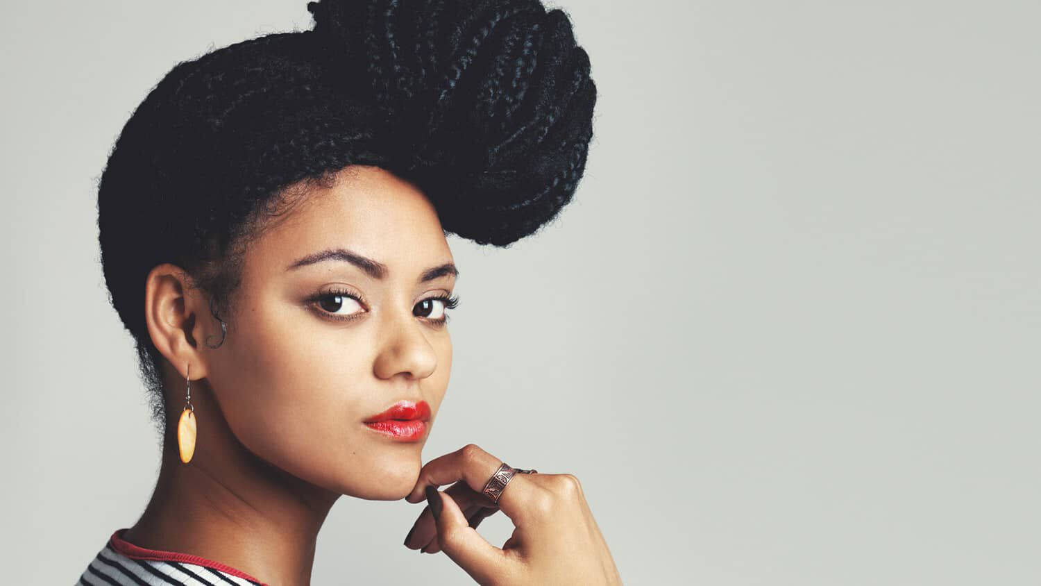 woman with long braids in a bun