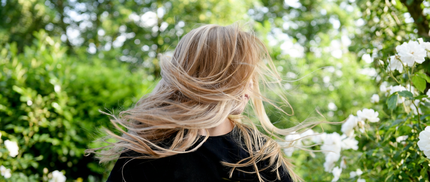 photo of woman with curly blonde hair