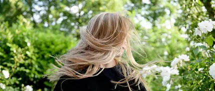 photo of woman with curly blonde hair
