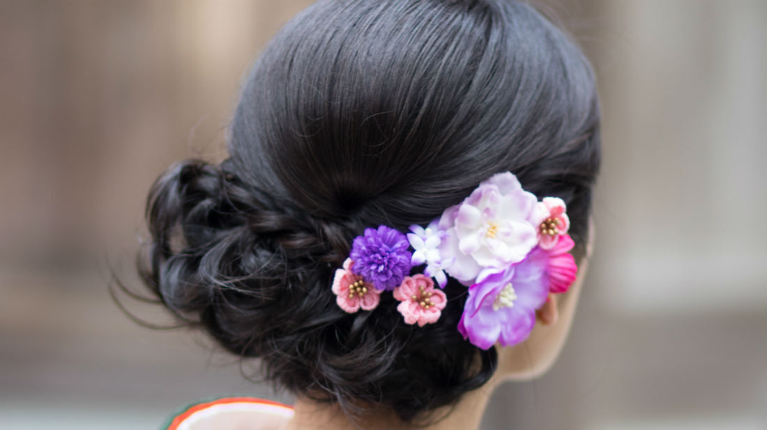 back of woman's head with flower braid