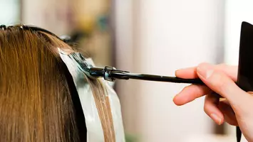 woman getting highlights