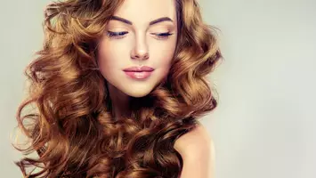 photo of woman with curly hair dyson airwrap