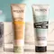 of Color Wow Anti-Frizz Spray for Curly Hair, Mizani Curl Enhancing Lotion, Redken Sculpting Curl Gel, and/or L'Oreal Paris Curl Expression 10-In-1 Cream-In-Mousse) lined up on a bathroom counter. A window featuring a blazing sun pictured as well.