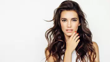 photo of woman with voluminous hair root perms