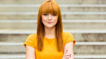 photo of woman with marigold hair color