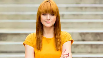 photo of woman with marigold hair color