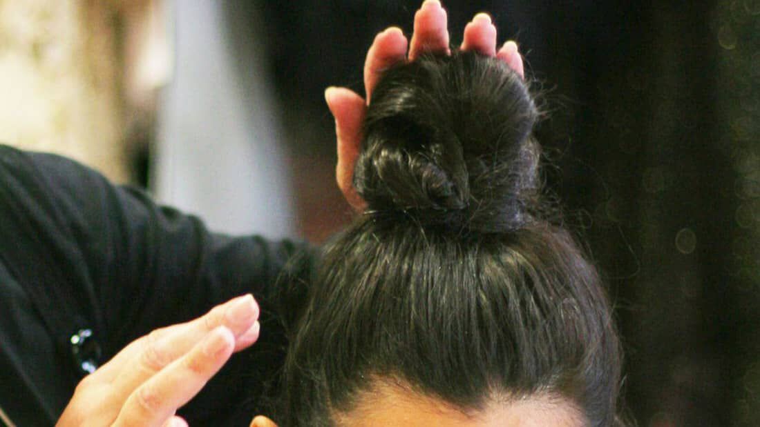 photo of bun hairstyle for growing out hair
