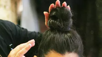 photo of bun hairstyle for growing out hair