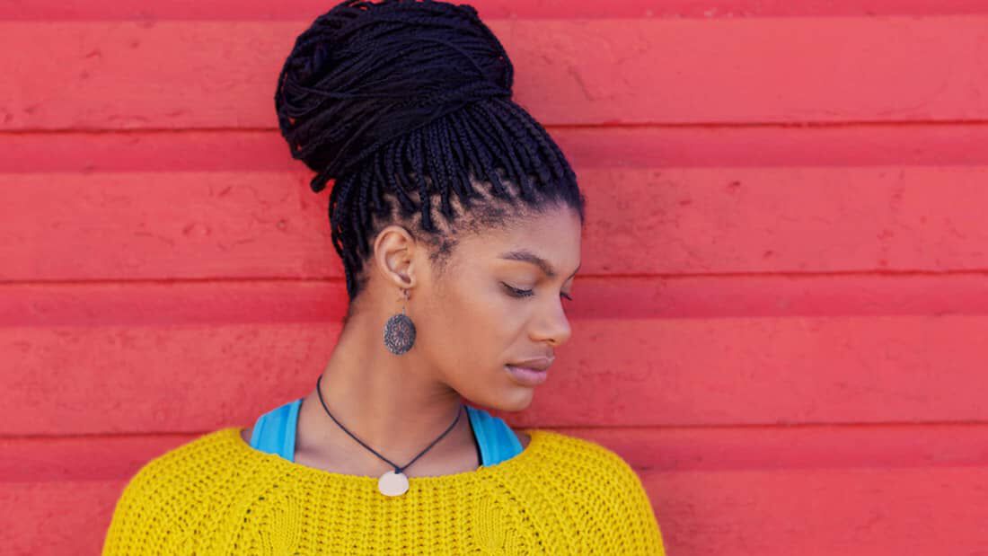photo of woman with natural braided hairstyle