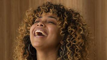 woman with bangs and frizzy curly hair