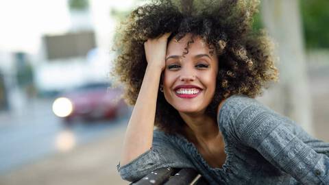 Woman with dyed curly hair
