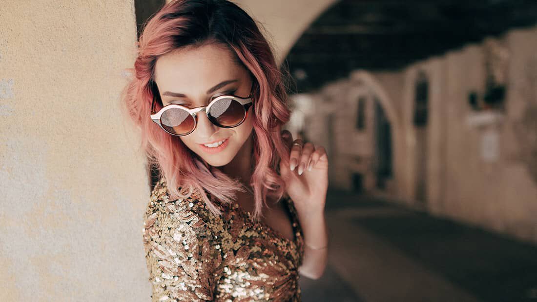 photo of woman with metallic pink hair color