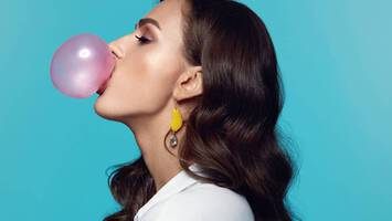 woman with curly hair and gum how to get gum out of hair