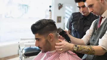 Man gets his hair cut