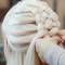 photo of stylist creating five strand braid