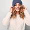 photo of woman with blonde hair wearing hat