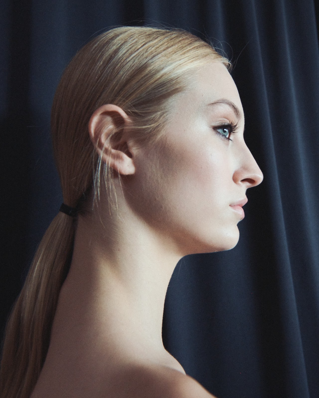 Woman with 70's inspired ponytail at NYFW