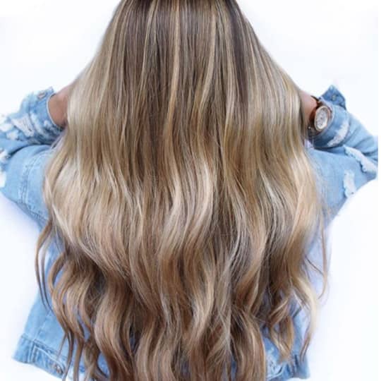 photo of woman with teasylights in hair