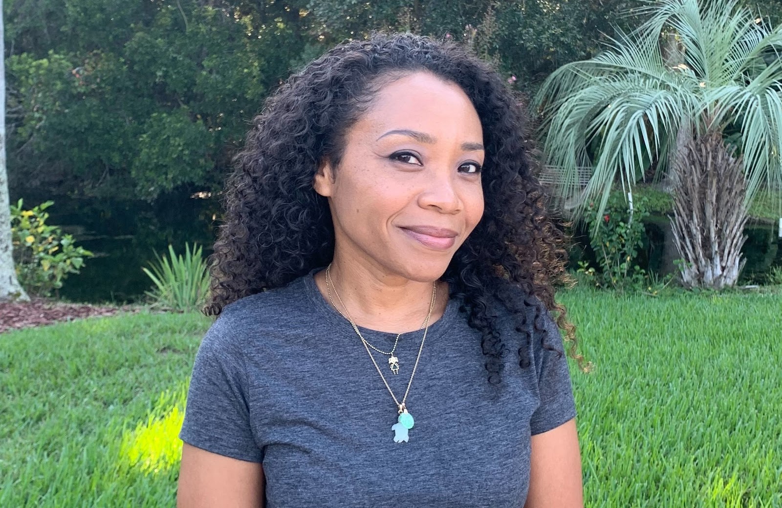 author Del Sandeen flaunting her naturally curly hair