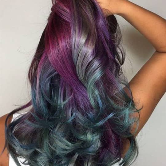 A woman with a beautiful magenta hairstyle