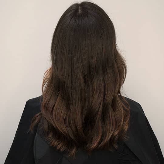 highlighted balayage hair from behind