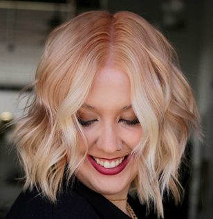Instagram photo of a woman with strawberry blonde-colored hair.