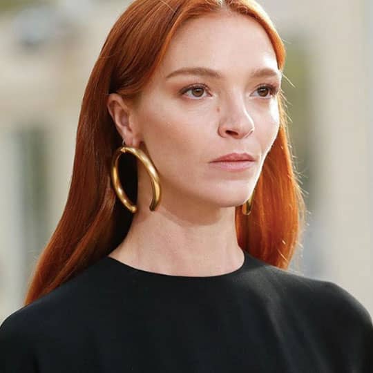 red haired woman at paris fashion week