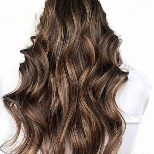 photo of woman with teasylights in hair