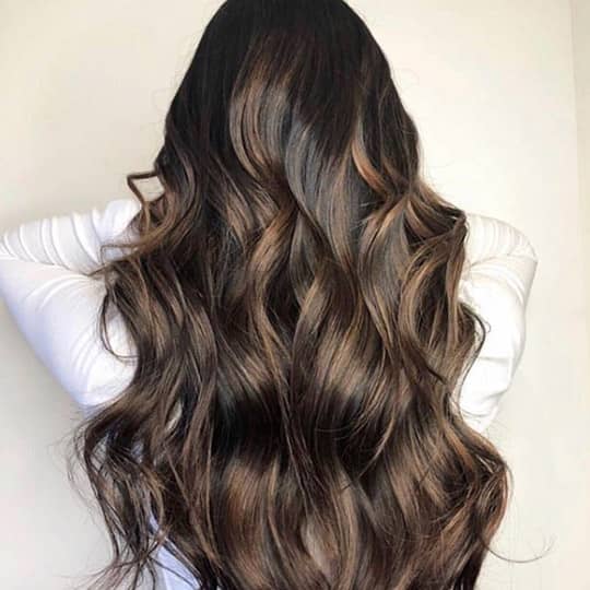 photo of woman with long brunette hair hair rinses