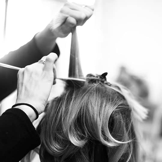 styling hair at renaissance salon