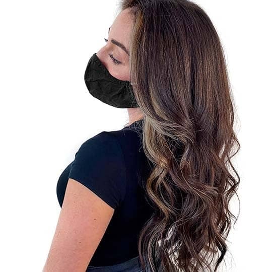 A woman with cool-tone brown hair the new celeb inspired trend