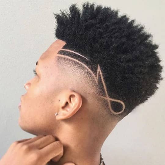 man with shaved design