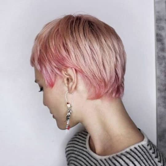 woman with pink pixie to look younger