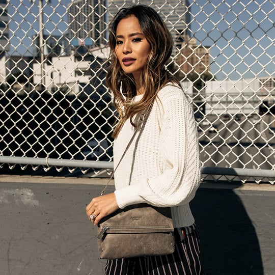 jamie chung posing outside with wavy hair