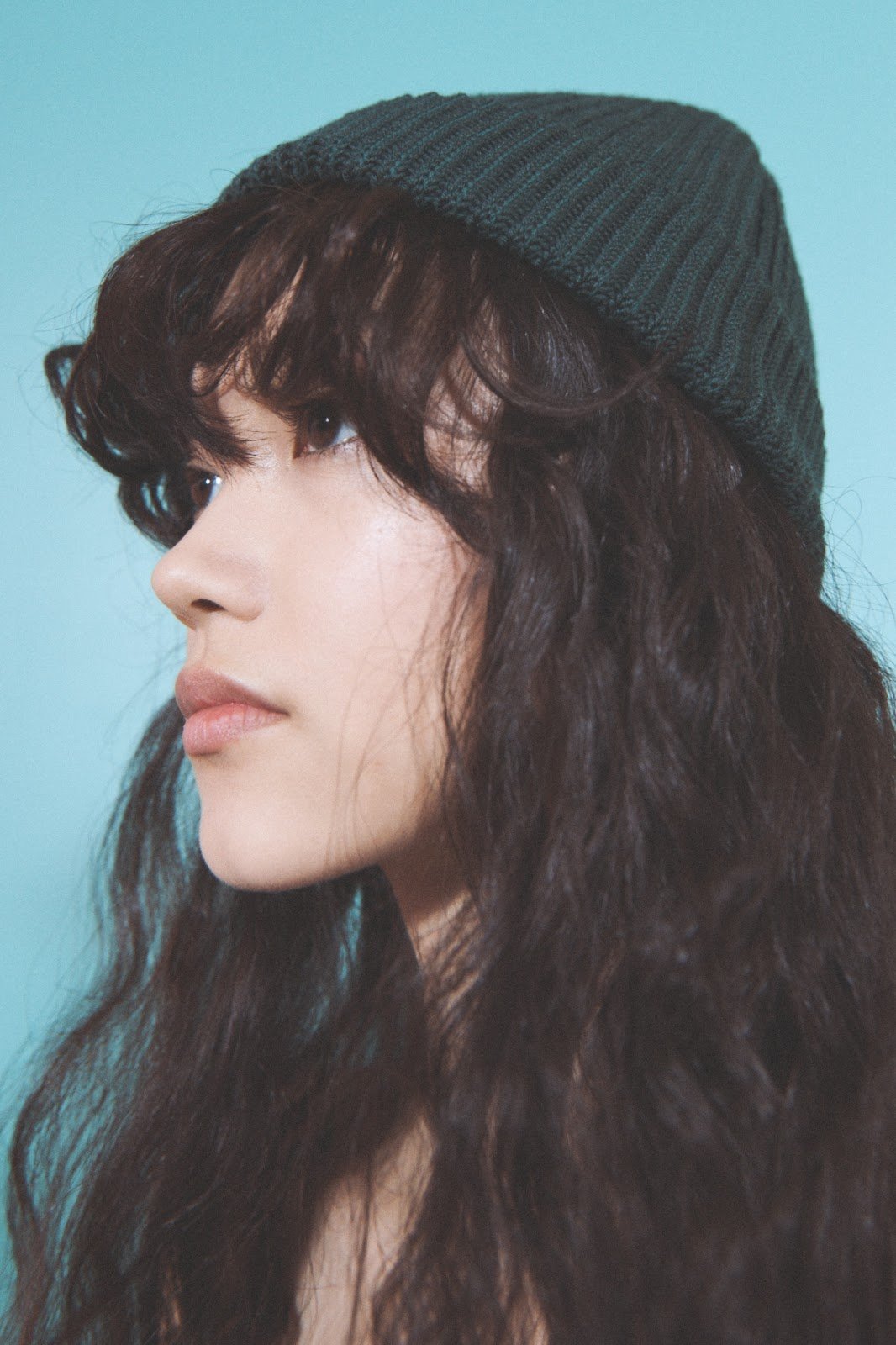 Woman with beanie and long hair at NYFW 2020